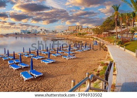 Cyprus panorama . Bird's eye view of Protaras. Beach holidays in Mediterranean. Kalamies beach in Protaras city. Beach with blue sunbeds and umbrellas. Sandy coast of Cyprus. Panorama Protaras