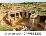 Cyprus. Pathos. Tombs of the Kings. Paphos Royal antique necropolis. Underground hall with columns under the open sky. Paphos archaeological memorial. Touristic sightseeing Cyprus. Travel to Cyprus.