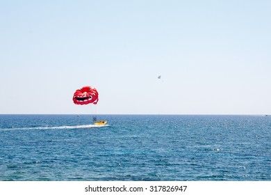 Cyprus. Protaras. Parasailing Behind A Boat.