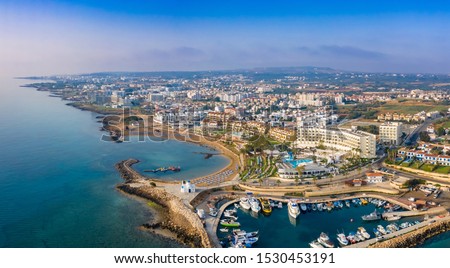 Cyprus. Protaras. The Port Of Paralimni. Pernera. Panorama of the Mediterranean coast from a height. Top view of kalamies beach. Church of St. Nicholas in Cyprus. Cyprus beach resort. Boat Harbor.