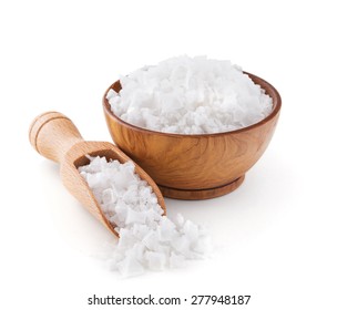 Cyprus sea salt flakes in a wooden bowl isolated on white background