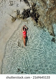 Cyprus views from a drone. Aerial view of a girl on ocean. Vacation and adventure. Turquoise water. Top view from drone at ocean, azure watre and relax girl. Travel and relax image
