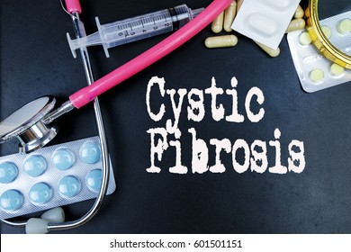 Cystic Fibrosis word, medical term word with medical concepts in blackboard and medical equipment. 