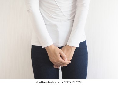 Cystitis in asian woman and hand holding pressing her crotch lower abdomen case of abdominal pain with isolated on white background using for health care concept. 
