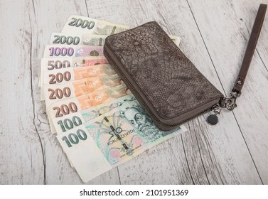 Czech banknotes and wallet on the table. Financial concept in Czech currency. business, finance, saving and cash concept - close up of euro paper money and coins on table - Shutterstock ID 2101951369