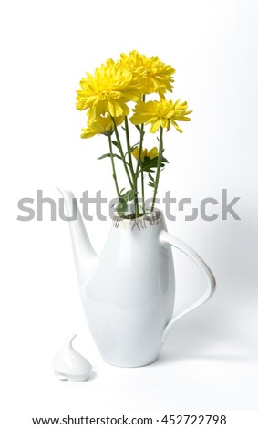Czech ceramic white teapot with yellow flowers on white background, dating back to the nineteen eighties