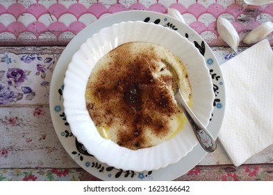 Czech food: A traditional children's dish - sweet semolina porridge (krupicova kase) sprinkled with cocoa powder and melted butter