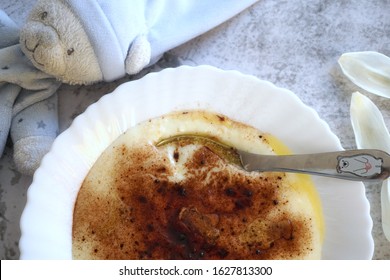 Czech Food: A Traditional Children's Dish - Sweet Semolina Porridge (krupicova Kase) Sprinkled With Cocoa Powder And Melted Butter