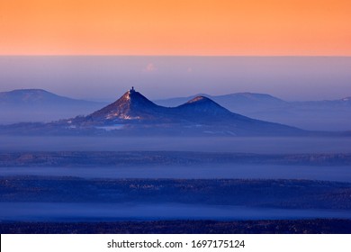 Czech Landscape Aerial View, Bezdez Hill. Pink Morning Light Before Sunrise. Winter Twilight, Cold Nature In Forest. Orlicke Hory, Czech Republic. Mountain Landscape With Fog Forest, Snow And Rime.