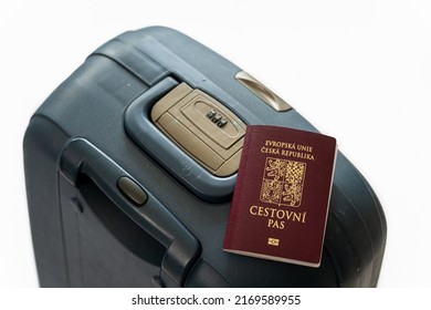 Czech passport isolated on travel suitcase and white background