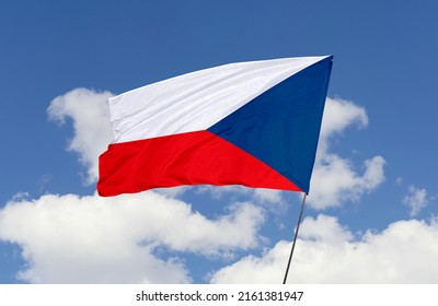 Czech Republic flag is isolated on the blue sky with a clipping path. flag symbols of Czech Republic.