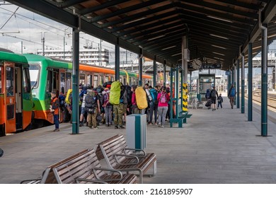 Plzeň, Czech Republic - May 29 2022: People Getting On And Off The Covered Train Platform At The End Of The Weekend At The Train Station In Sunny Weather