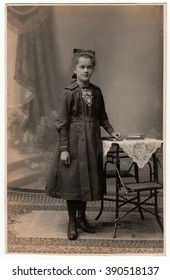 THE CZECHOSLOVAK REPUBLIC - CIRCA 1920s: Vintage photo shows young girl wears Sunday best dress.  Antique black & white studio portrait.