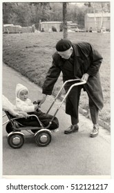 THE CZECHOSLOVAK SOCIALIST REPUBLIC - CIRCA 1950s: Vintage Photo Shows Grandfather With A Small Baby In The Pram (carriage). Retro Black & White  Photography 