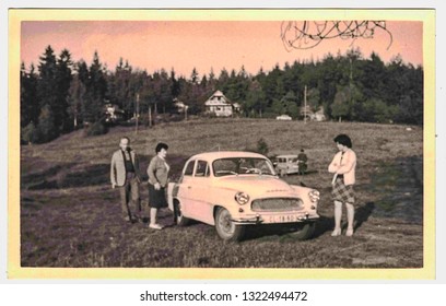 THE CZECHOSLOVAK SOCIALIST REPUBLIC - CIRCA 1960s: Retro photo shows familly and retro car (brand Octavia) during weekend trip. Black white photo. 