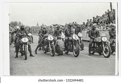 THE CZECHOSLOVAK SOCIALIST REPUBLIC - CIRCA 1970s: Retro photo shows motorcycle riders preparing on motorcycle race. Black white photo. 