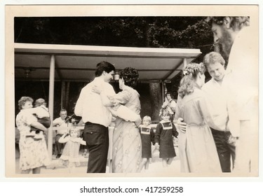 THE CZECHOSLOVAK SOCIALIST REPUBLIC - CIRCA 1970s: Retro Photo Shows People Dance On Wedding Celebration. Black & White Vintage Photography.