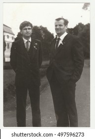 THE CZECHOSLOVAK SOCIALIST REPUBLIC - CIRCA 1970s: Vintage Photo Shows Wedding Guests (men)  Pose Outdoors. Retro Black & White  Photography.