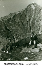 THE CZECHOSLOVAK SOCIALIST REPUBLIC - CIRCA 1970s: Retro Photo Shows Tourists Have A Rest During Mountain Trip. Vintage Photography.