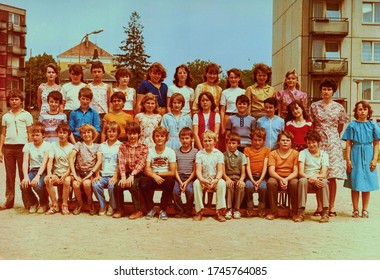 THE CZECHOSLOVAK SOCIALIST REPUBLIC - CIRCA 1980s: Retro Photo Of Group Of School Pupils (teenagers) With Their Female Teacher.