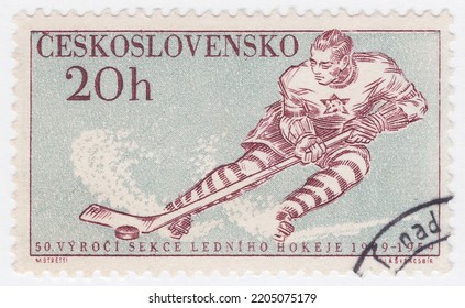 CZECHOSLOVAKIA - 1959 February 14: An 20 Hellers Dark Brown And Gray Postage Stamp Showing Ice Hockey, Is A Team Sport Played On Ice Skates, Usually On An Ice Skating Rink