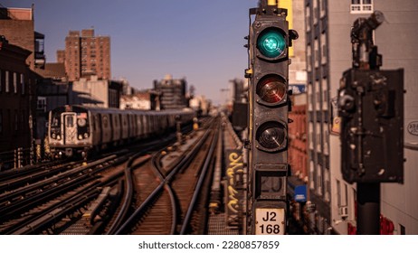 The D train pulls into Brooklyn. Watch your step around the tracks.