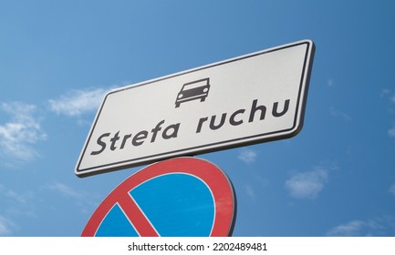 D-52 Traffic zone sign in Poland. Entering an internal road located in the traffic zone. With B-35 No parking sign below. Letters in Polish language, Strefa Ruchu means Traffic Zone. - Shutterstock ID 2202489481