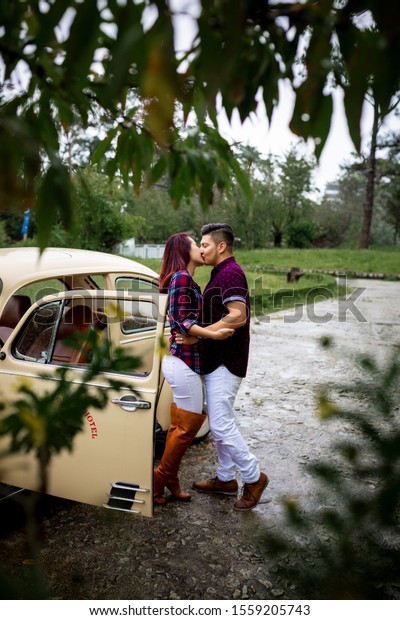 Da Lat city, Viet Nam, 10 Nov 2019: The couple kisses\
on the antique car