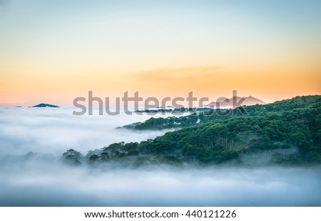 Da Lat, Vietnam, sun rise on mountain in fog