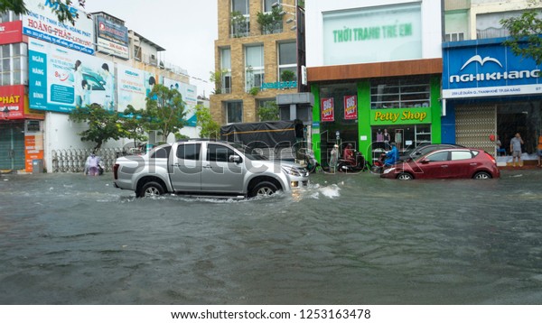  Da Nang city, Vietnam-\
December 9/2018, city is flooding in the raining season,a lot of\
water in the traffic,flood ed cars,typhoon in Vietnam and heavy\
rain