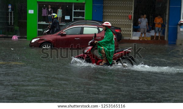  Da Nang city, Vietnam-
December 9/2018, city is flooding in the raining season,a lot of
water in the traffic,flood ed cars,typhoon in Vietnam and heavy
rain