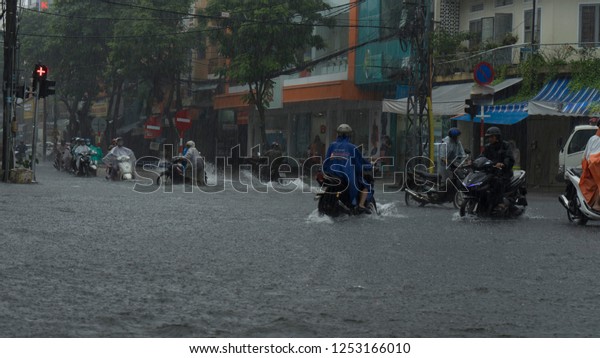  Da Nang city, Vietnam-\
December 9/2018, city is flooding in the raining season,a lot of\
water in the traffic,flood ed cars,typhoon in Vietnam and heavy\
rain