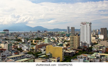 DA NANG, VIETNAM - AUGUST 24, 2019 - General View Of The City With Buildings And Mount In The Background And Clouds