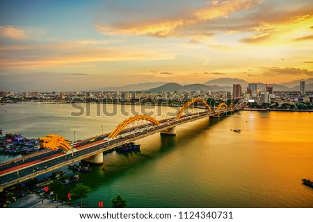 Da Nang, Vietnam: Dragon bridge at sunset.                