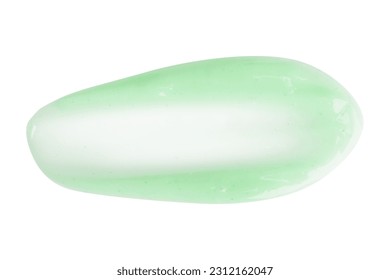 A dab of fresh light green cream or cucumber face mask. With granules and flecks. On a white background - Shutterstock ID 2312162047