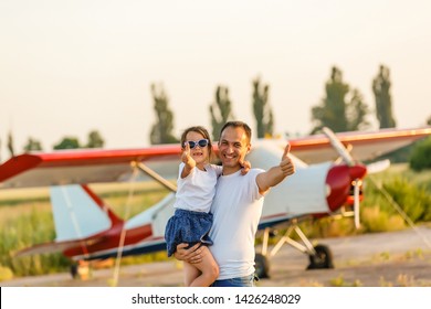 Dad And 7 Year Old Child Playing Plane