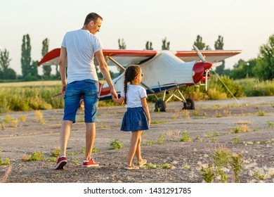 Dad And 7 Year Old Child Playing Plane