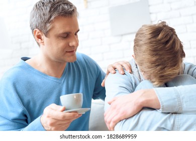 Dad Brought Coffee To His Son To Apologize. Dad Apologizes To His Son For His Guilt Before Him. Family Problems Of Dad And Son.