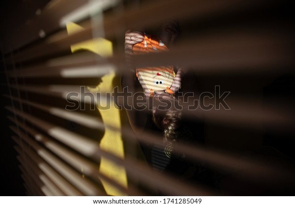 \
dad with children plays at home on a sunny day.\
family in the shade of the blinds. Dad and children having fun in\
the bedroom on a sunny day. The shadow of the blinds in the room\
with the family