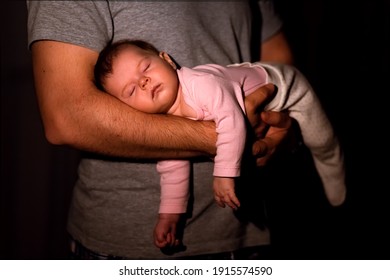 Dad Cradles Baby In His Arms At Home At Night By Lamp Light, Baby Sleep, Baby Colic.