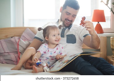 Dad And Daughter Reading A Book