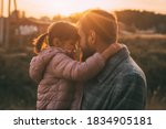 dad and daughter at sunset on a warm autumn day, beautiful light and sunset 