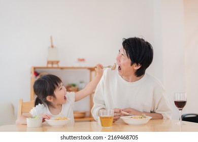 Dad Eating A Meal With His Daughter