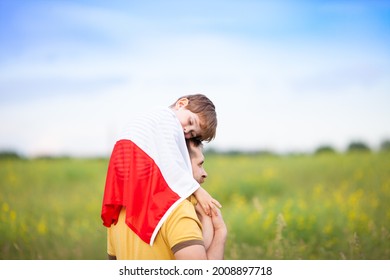 Dad with his little son sleeping on his shoulders in the field covered with flag of Poland. Father's day in Poland. Polish Flag Day. Independence Day. Love Poland, travel concept. Selective focus. - Shutterstock ID 2008897718
