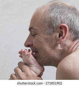 Dad Kissing Baby Feet