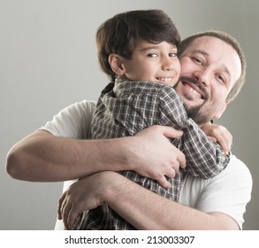 Dad And Little Son Hugging