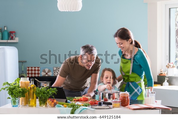 Dad Mom Their Little Daughter Cooking Stock Photo Edit Now 649125184