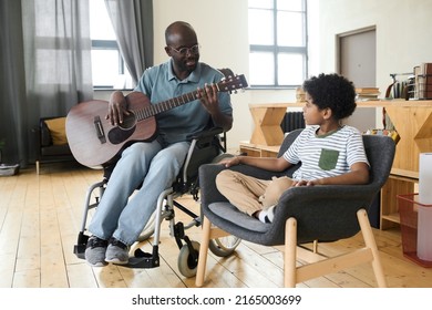 Dad Playing Guitar For His Son