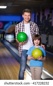 Dad And Son In Bowling 