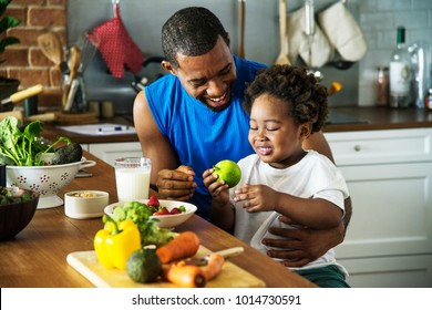 Dad and son cooking together